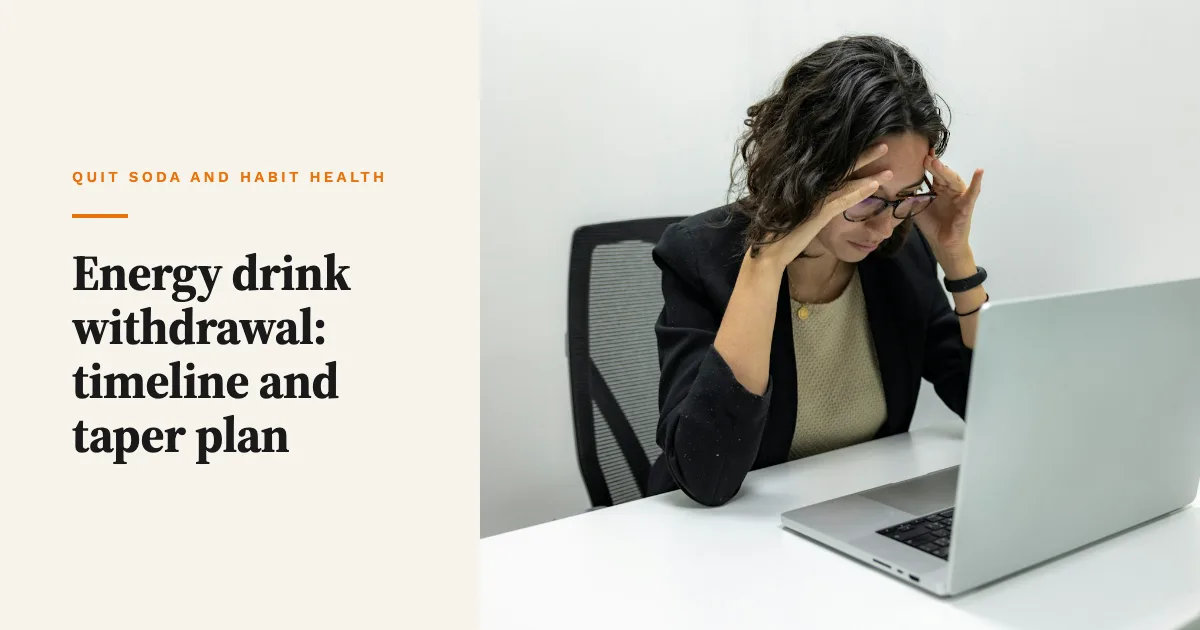 A tired woman at a laptop holding her head as if she has a headache