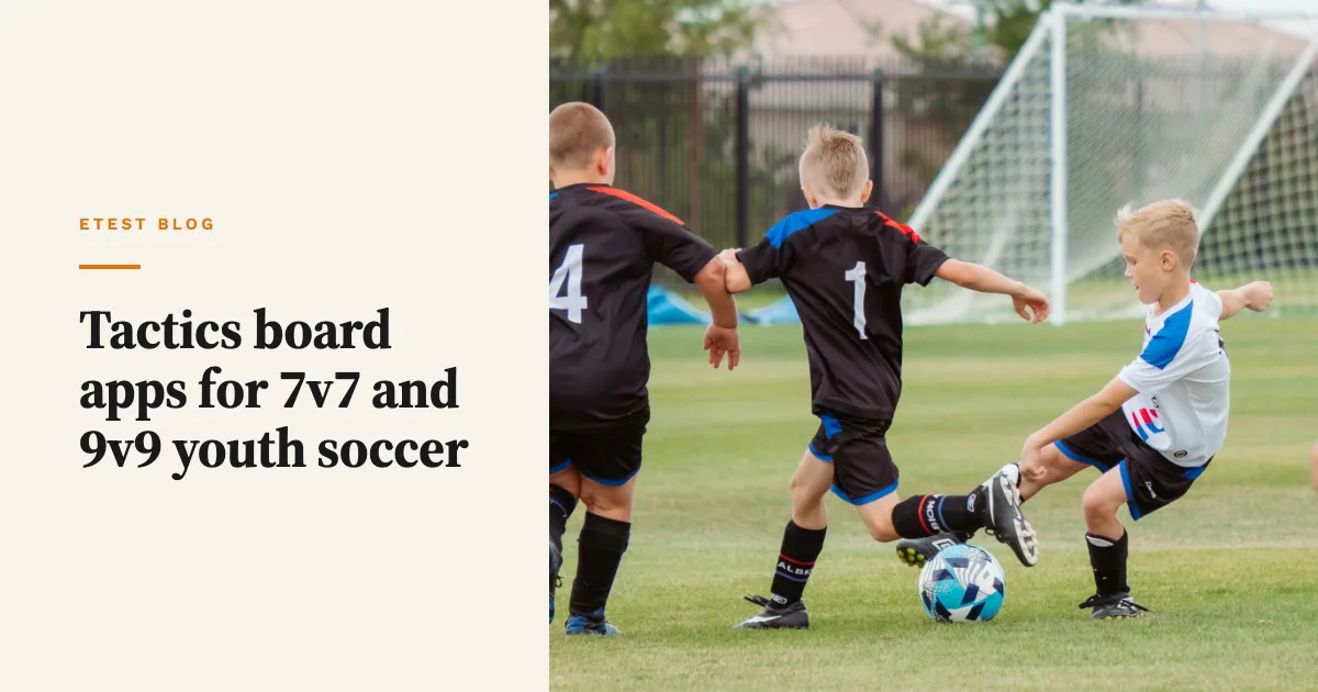Three young boys in football kits challenging for the ball on a grass pitch with a goal behind them